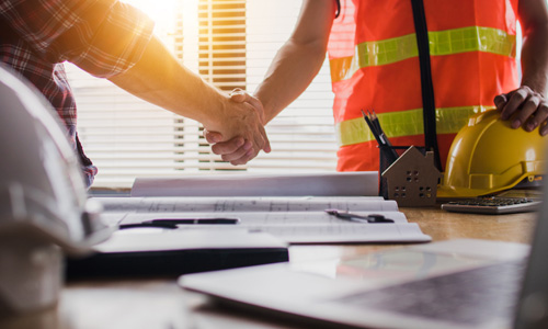 shaking hands with renovation contractor in Burlington