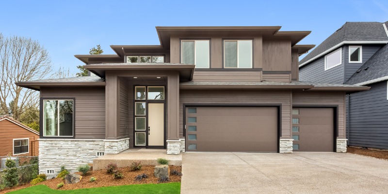 Modern home with monochrome style of home - Matching Your Garage Door to Your Home's Exterior: A Styling Guide