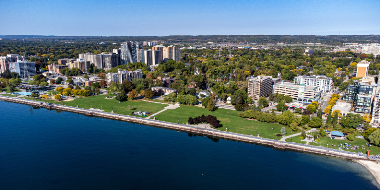 Aerial shot of downtown Burlington waterfront developments and urban skyline along Lake Ontario.